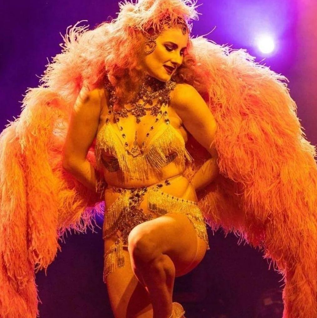 Woman with large feather fans