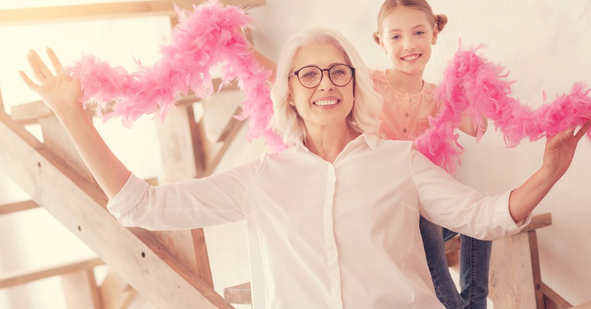 Granny and young lady posing with feather boas