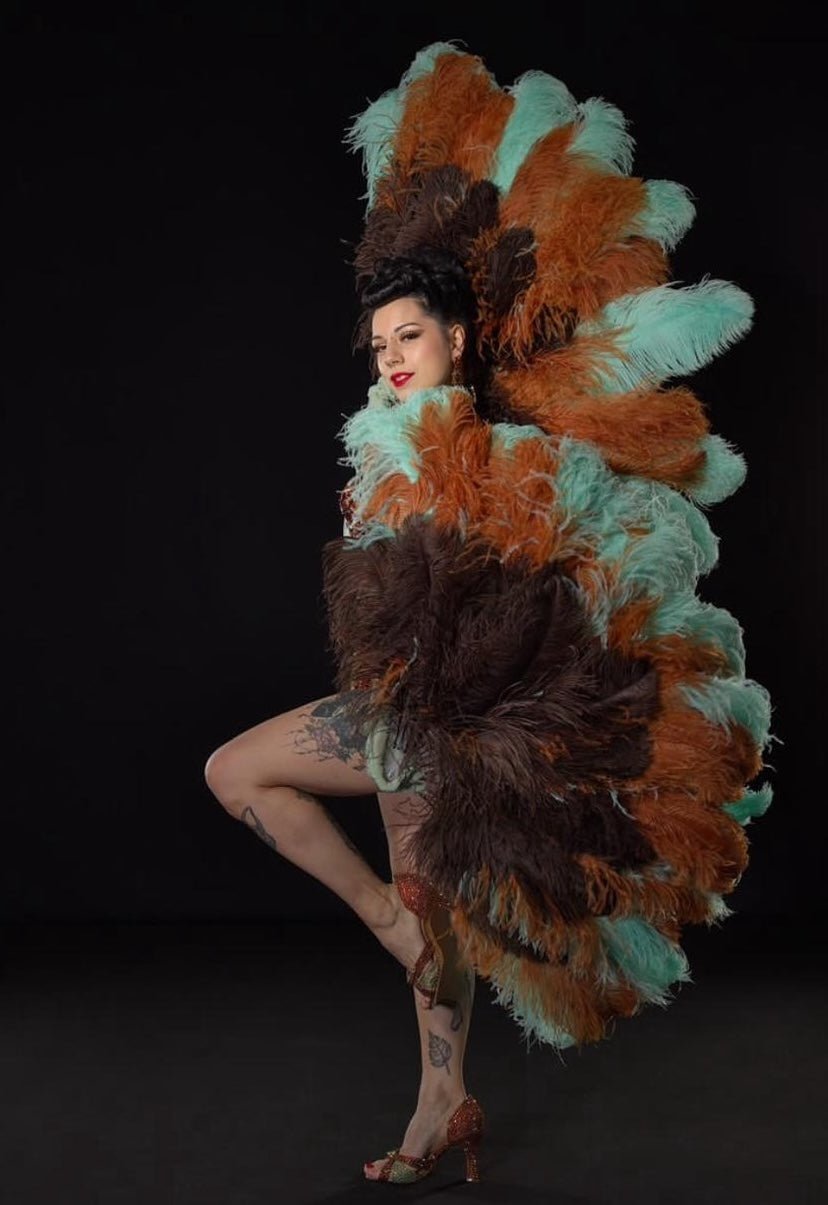 Woman with brown feather fans
