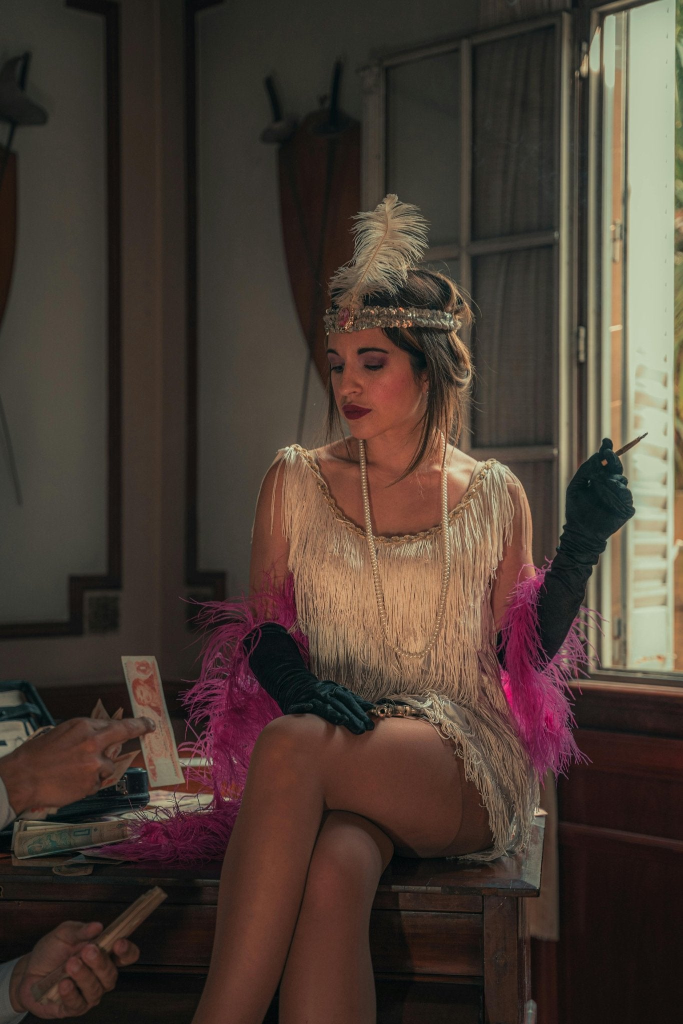 Glamour Woman in Dress Looking at Banknote in Hand