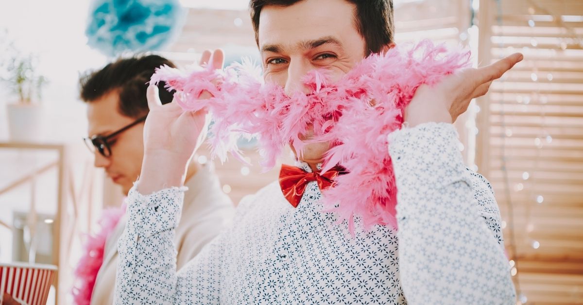 Gay Person Holding a Feather Boa