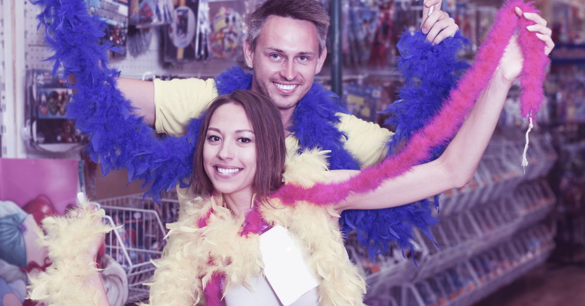 Happy young family wearing feather boa