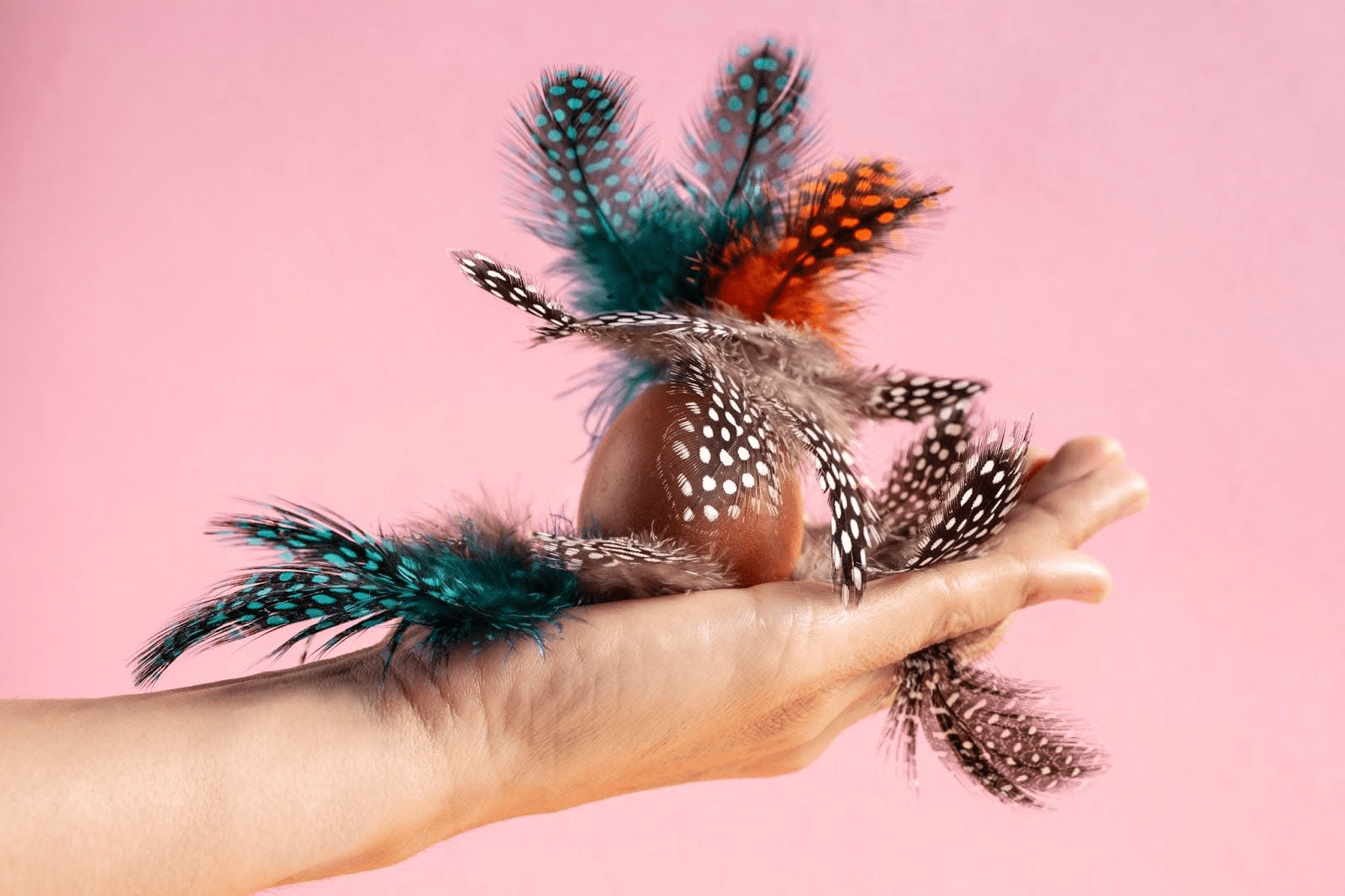 Lady holding feathers